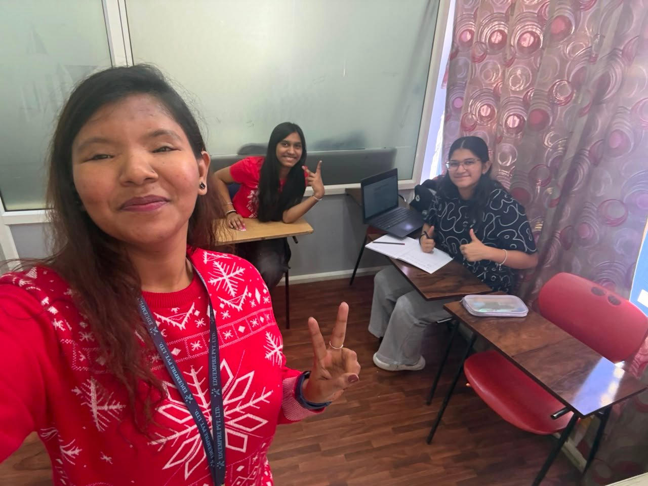 A mentor with students in a working session